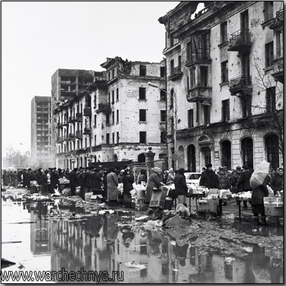 People shop at the market in downtown Grozny, Chechnya in...