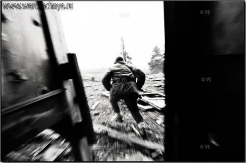 Chechen fighter flees the presidential palace in Grozny, ...