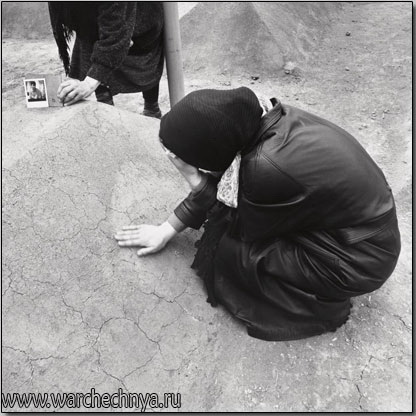 A woman grieves after a bomb exploded during a martyr cer...